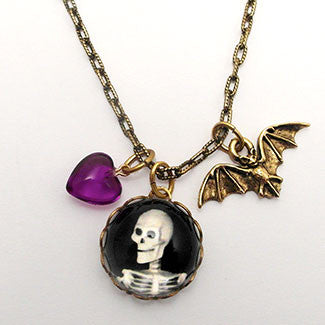 Smiling Skeleton with Bat Charm and Purple Heart Bead Necklaces